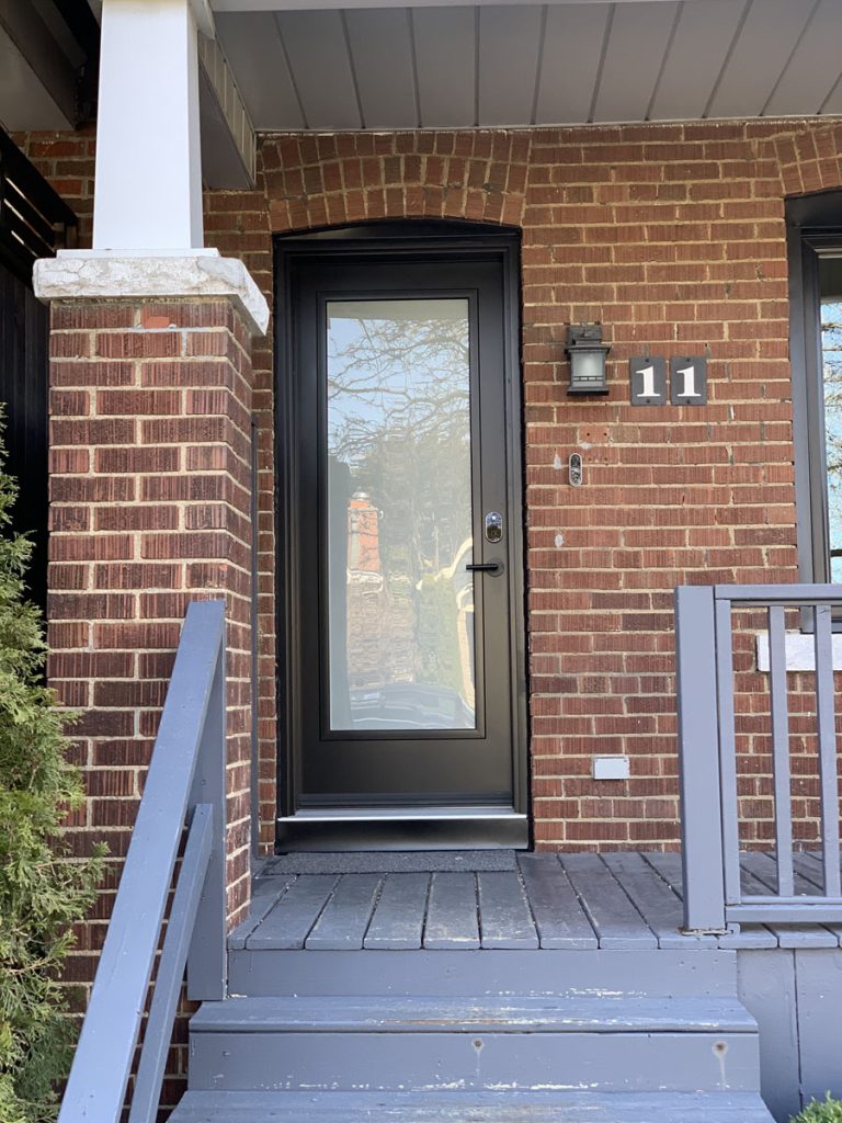 Full-lite frosted architectural black steel entrance with multi-point locking system