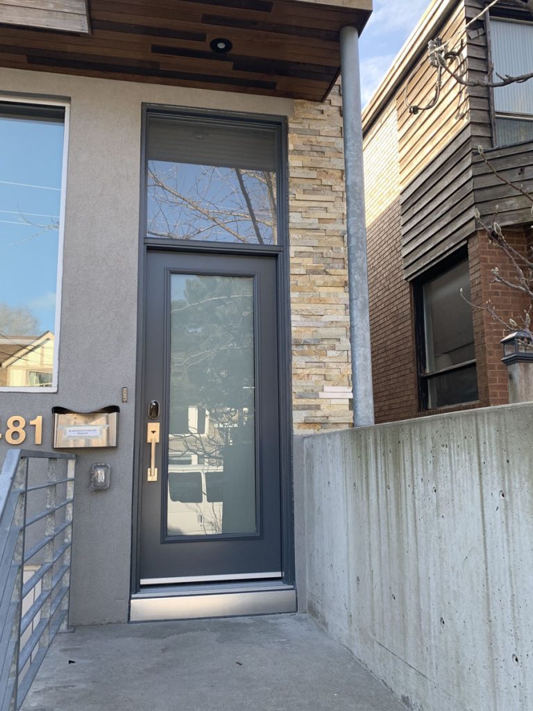 Custom dark oak woodgrain textured fiberglass entry door with classic decorative caming