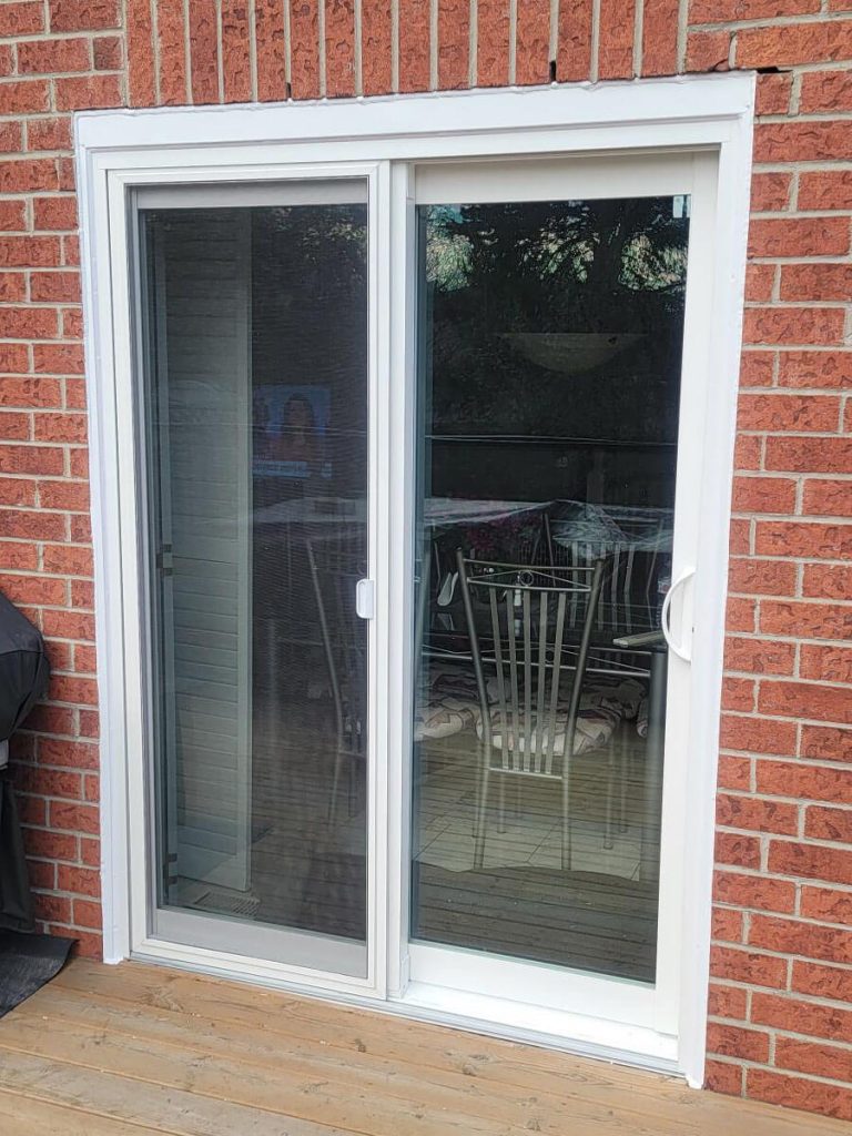 Oversized black aluminum-clad sliding patio door system with low-E argon thermal glass