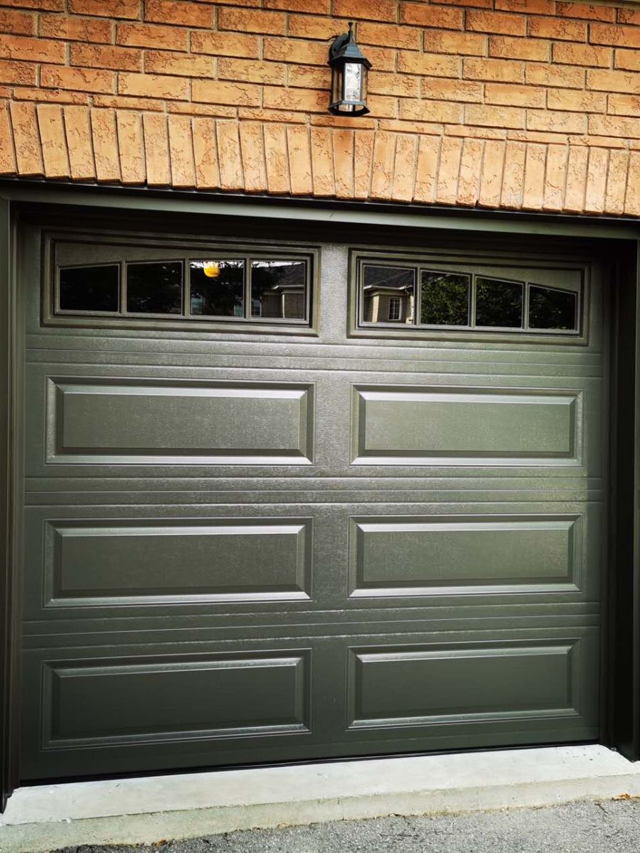 New dark green garage door installed by Comfort Windows and Doors in Vaughan